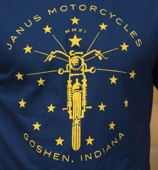 Blue T-shirt with Janus Motorcycles logo and Goshen Indiana text in yellow.