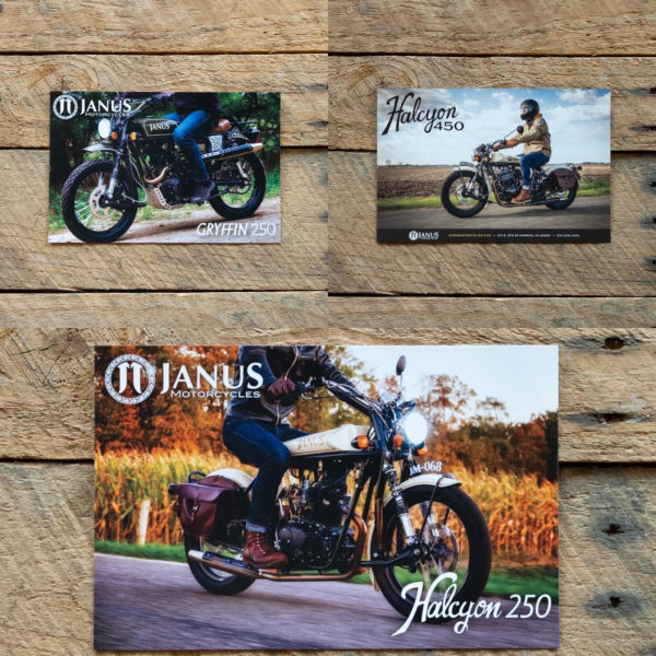 Janus motorcycles Gryffin 250 and Halcyon 250 and 450 models showcased on brochures on wooden background.