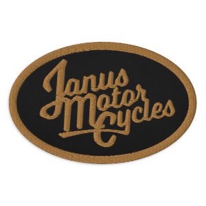 Embroidered Janus Motorcycles patch with gold and black threading.